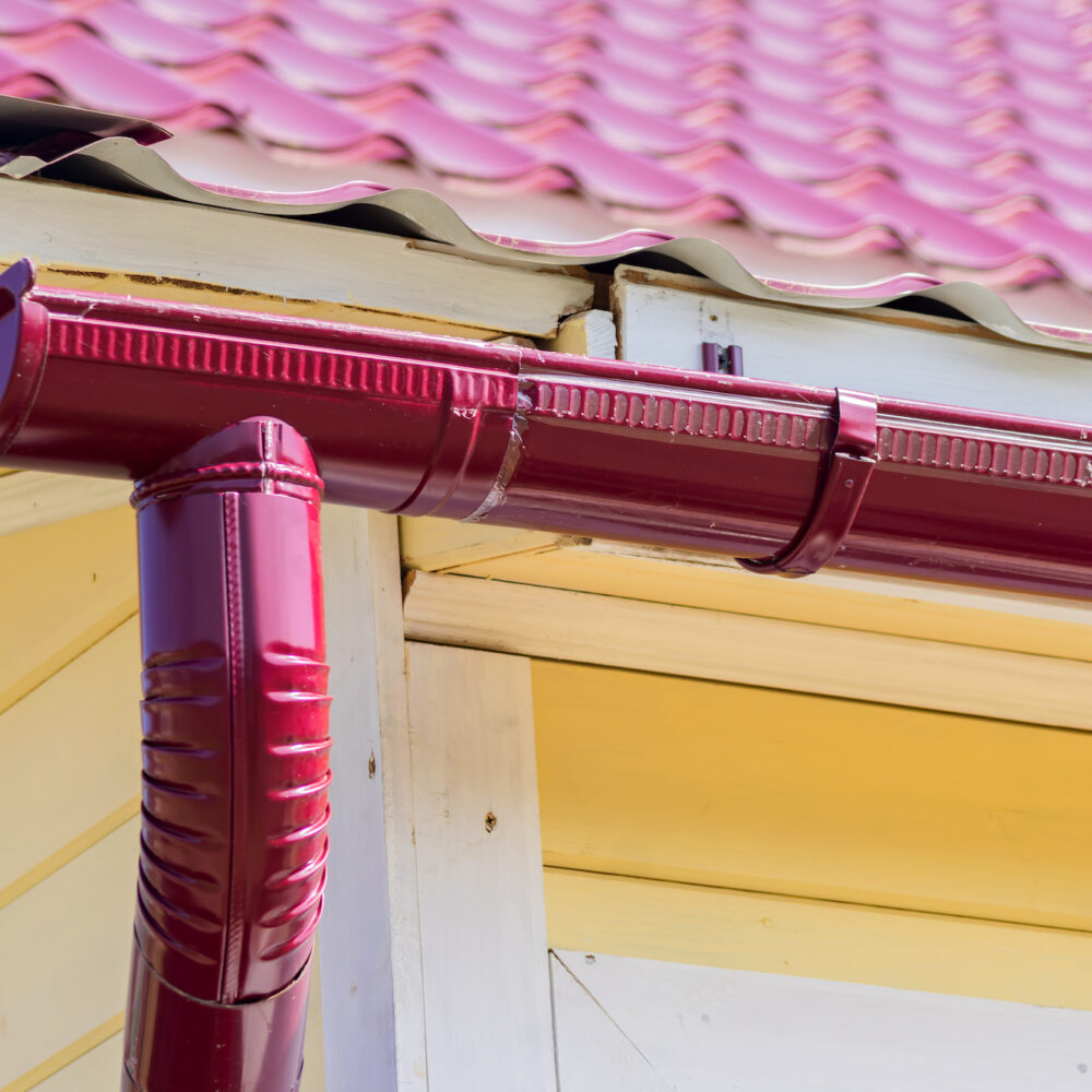 red gutter on the roof top of house